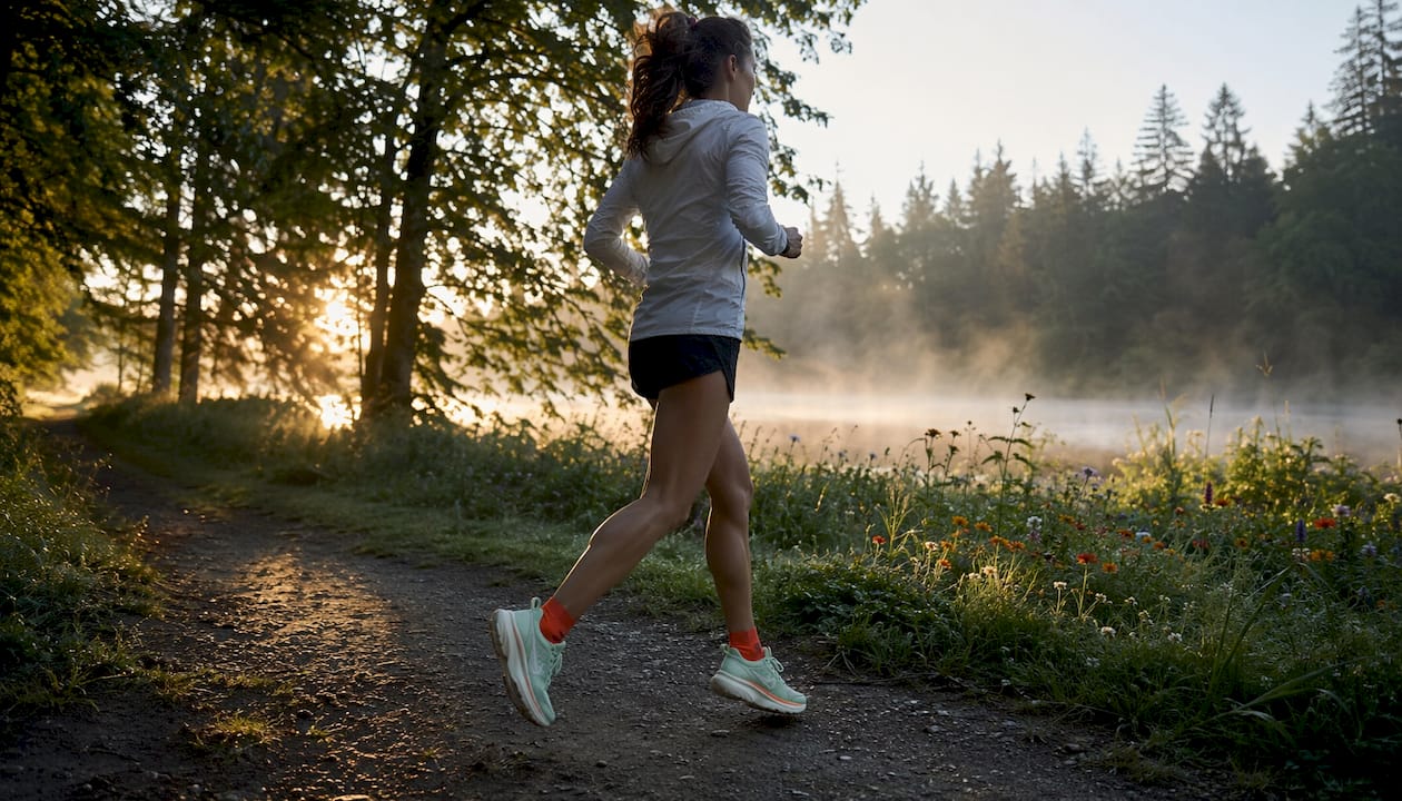 Hoka Clifton 10: Built for Long Daily Miles 2026 Lizard's Lunch Female runner jogging wearing Hoka Clifton 10