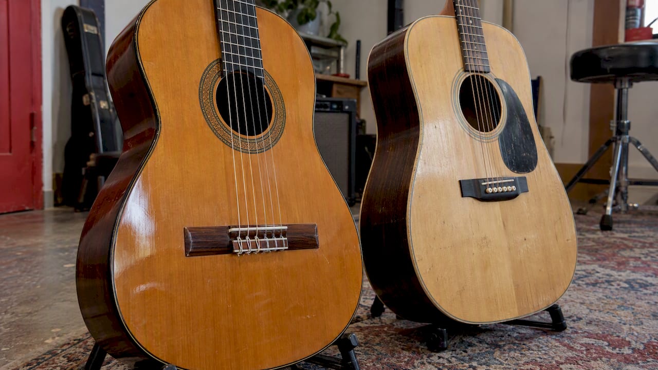 Nylon and steel guitar strings at their bridges